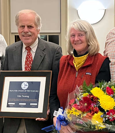 First Selectman Tim Griswold presents Edie Twining with a plaque